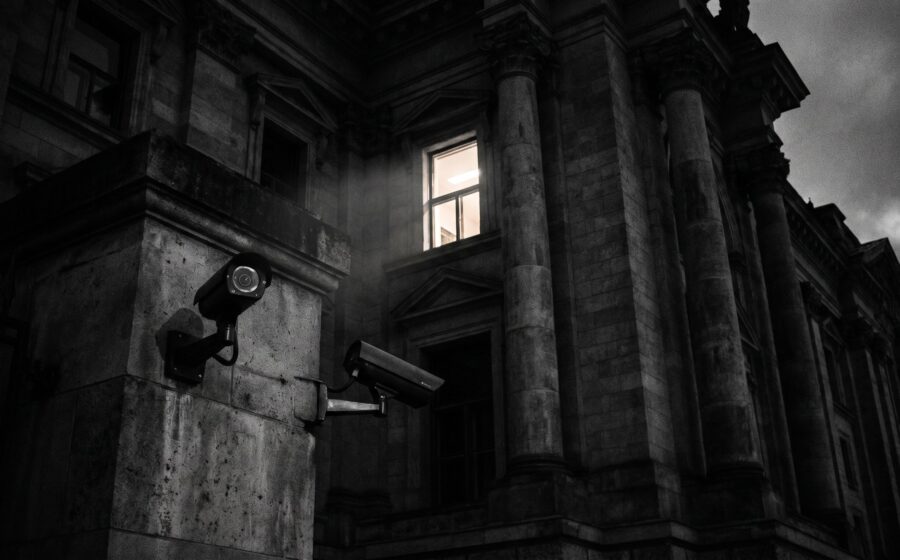 German federal government building at twilight with security cameras, institutional power and oversight