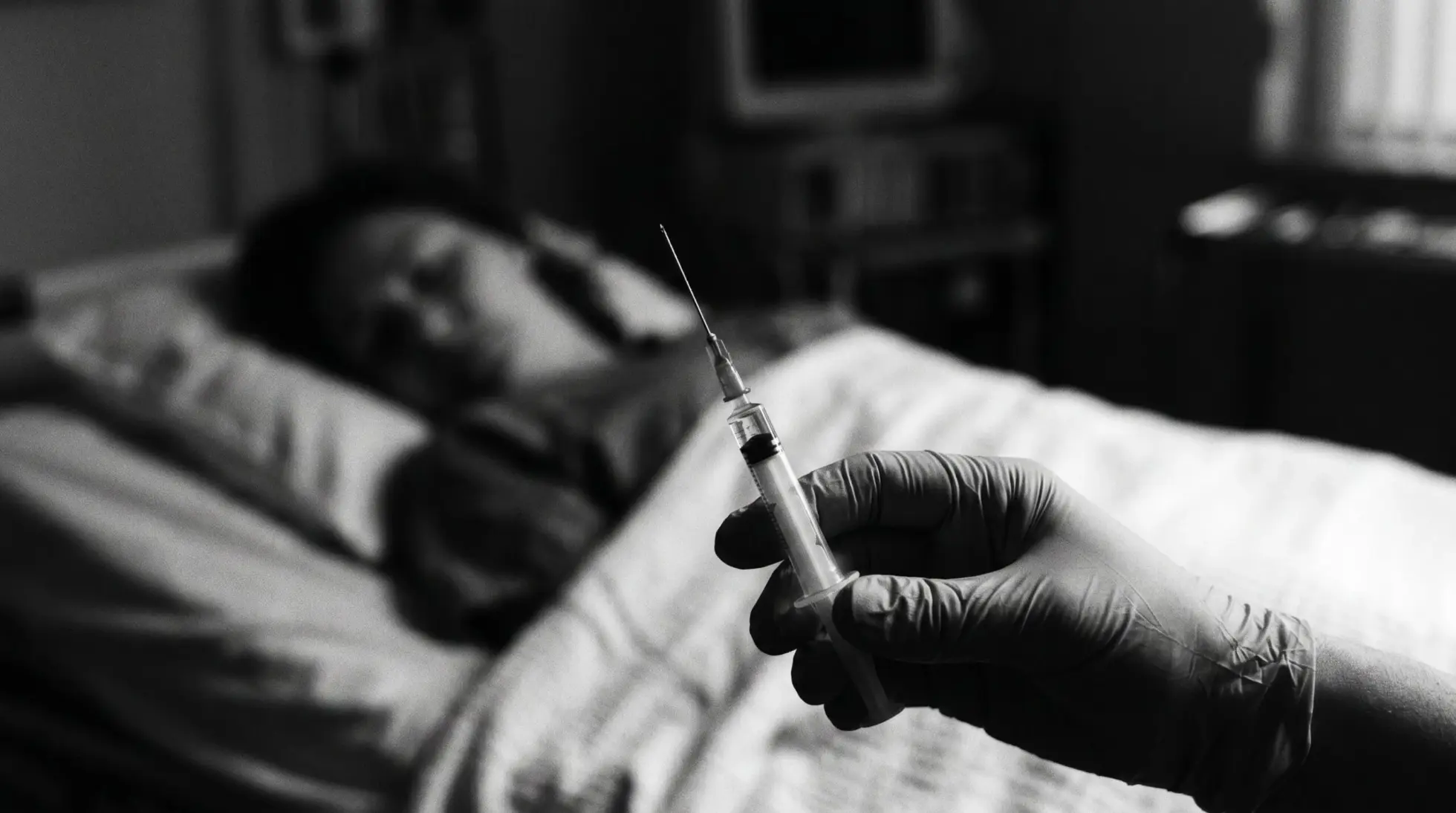 Hand holding a medical syringe with a sleeping figure blurred behind, on potassium chloride and the forensic detection gap