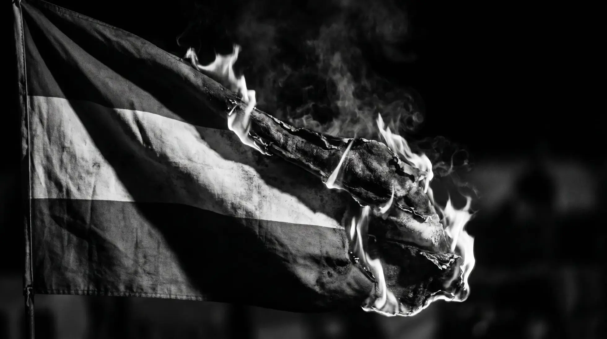 Burning Austrian flag in black and white, opening image of the forensic authenticity examination of the Ibiza video